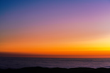 sunset over the clouds