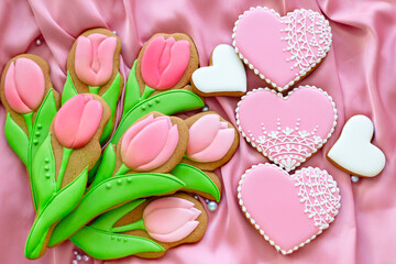 background banner greeting card for international women day or valentines day with pink heart love, tulips gingerbread cookies on silk fabric background