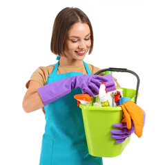 Beautiful young woman with cleaning supplies on white background