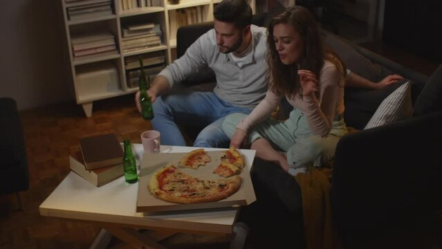 friends eating pizza at home