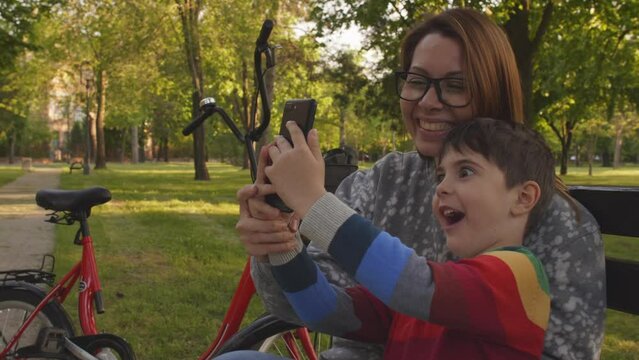mother and son enjoying time in public park