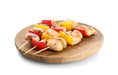 Wooden board of grilled chicken skewers with vegetables isolated on white background