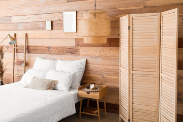 Interior of modern bedroom with wooden wall