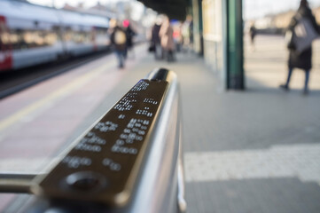 close up of braille signs at train station