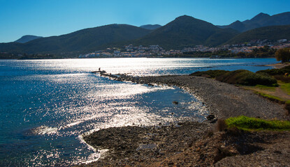 Fototapeta na wymiar DATCA, TURKEY: Beautiful landscape with a view of the sea and the town of Datca on a sunny day.