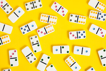Dominoes on a yellow background.Board game.
