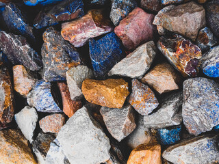 Close up Shot of faded scene of stones in different colors. Crushed gravel pebbles and rocks piled in a heap