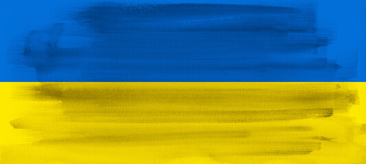 Abstract patriotic brushstroke paint brush splash in the colors of the flag of Ukraine, isolated on aquarelle paper background