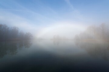 Fog Bow over Alpine Lake Maggiore in Ticino, Switzerland.