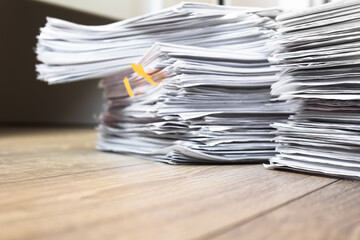 bundles bales of paper documents. stacks packs pile on the desk in the office. waste paper, paper trash
