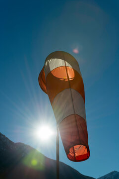 Windsock with Mountain and Sunbeam in Locarno, Switzerland.
