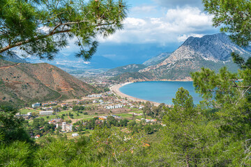 The Bay of Adrasan extends along more than 2.5 km of Antalya, naturally protected area, surrounded by a national park with pine forests, Taurus Mountains, blue water lagoons and sandy beaches.