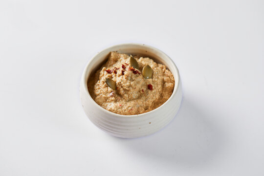 Aj&iacute; de pepa is a traditional ecuadorian hot sauce made of squash seeds. It&rsquo;s on a white background 