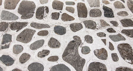 Stone paved street background in Greece.  - obrazy, fototapety, plakaty