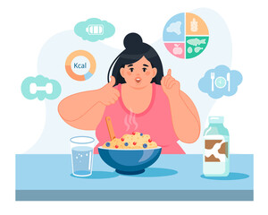 A happy obese woman is sitting at the table with a plate of porridge