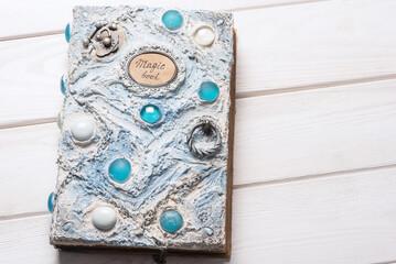 A white book of magic top view background.