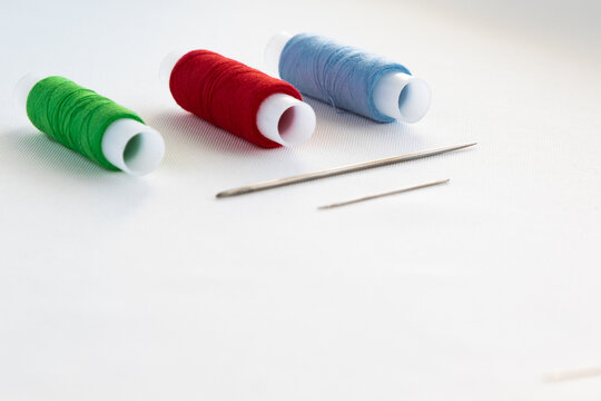 A set for sewing and repairing clothes with your own hands on a white background and copy space
