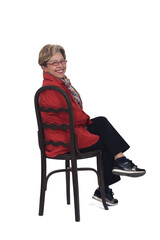 Fototapeta premium senior woman turning from a chair on white background