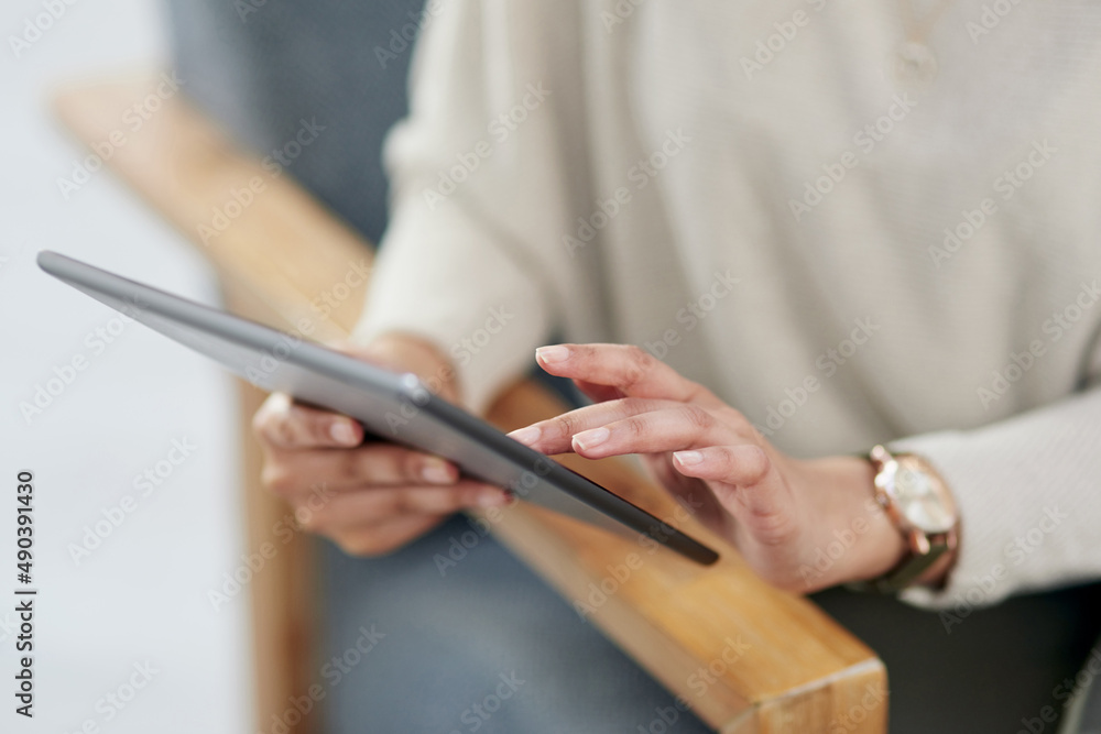 Poster ditch a heavy laptop for a slim digital tablet instead. closeup shot of an unrecognisable businesswo