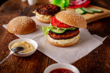 Ingredients for hamburger, cheeseburger. Wooden background. Home cooking hamburger. Food concept. Hamburger day.