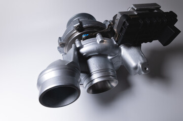 Spare part New car turbine on a white background. close-up. Car parts copy space