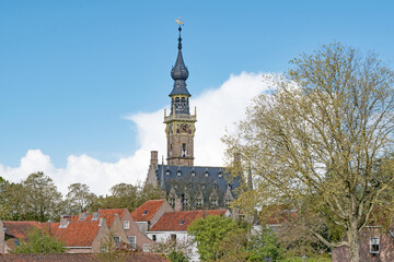 Fototapeta na wymiar The Stadhuis van Veere museum bell tower overlooks Veere, The Netherlands.