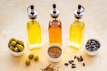 Different kind of cooking oil - sunflower olive and sesame oil with seeds