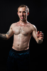 Obraz premium Man on black background keeps dumbbells pumped up in fitness bodybuilding biceps torso, training workout athletic person Young skin human fit