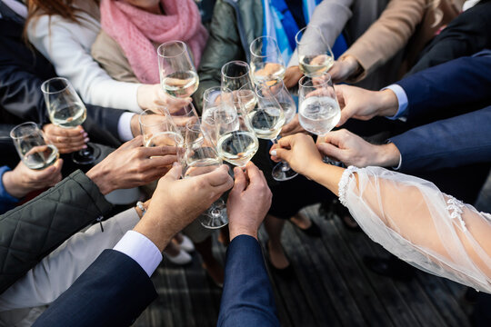 group of people toasting champagne