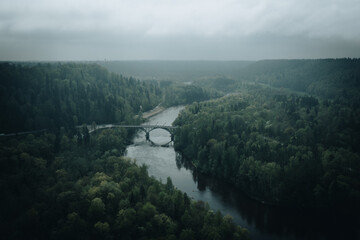 Aerial view of the foggy river Gauja valley in Sigulda, Latvia