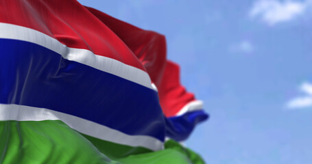 Detail of the national flag of Gambia waving in the wind on a clear day