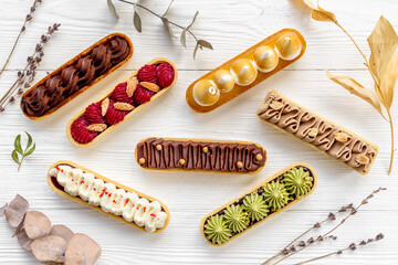 Delightful set of eclairs with pistachio raspberries and chocolate