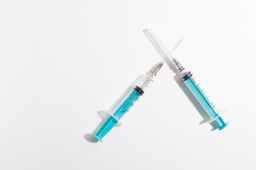 Medical syringe on a white background. A syringe for injection. The concept of health and beauty