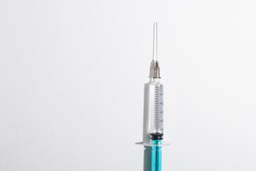 Medical syringe on a white background. A syringe for injection. The concept of health and beauty