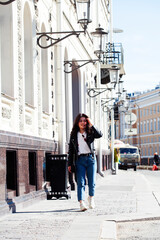 young pretty asian girl wearing leather jacket outside on big city street, lifestyle people concept