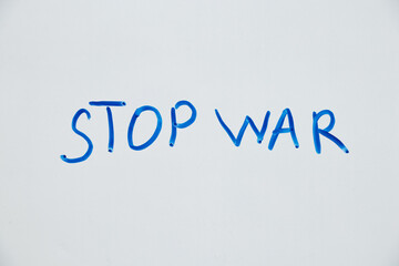 Fototapeta na wymiar Written text stop war on white background, protest action, no war between Russia and Ukraine 2022
