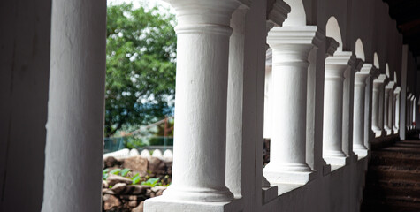 Dambulla cave temple white pillars on leading lines 