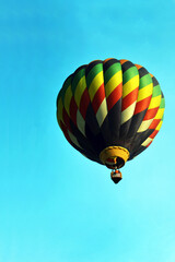 Hot air balloon flying up in the sky 