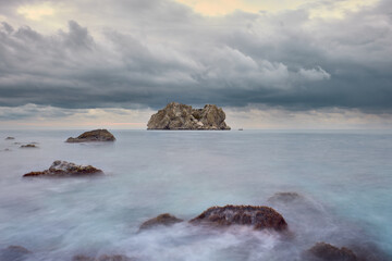 Cloudy morning on Black Sea: rocks and stones, water like smoke, Mediterranean nature.