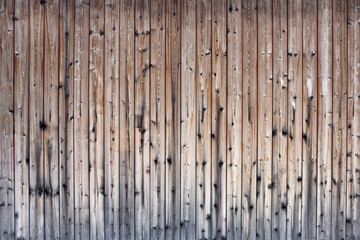 A brown wooden texture of a fence.