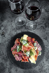italian antipasti with red wine. Appetizers. differents antipasti traditional Spanish meat snacks...