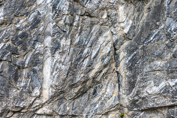 Marble surface with veins and a beautiful pattern on an industrial quarry. Karelia. Russia