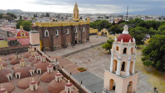 Aerial Drone Shot of San Gabriel Archangel Cathedral at cloudy day in Cholula, Puebla, Mexico