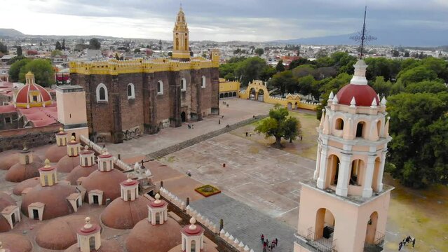 Aerial Drone Shot of San Gabriel Archangel Cathedral at cloudy day in Cholula, Puebla, Mexico