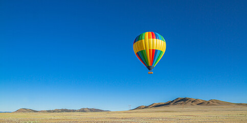 Colorful hot air balloon in the desert