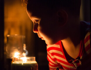 Candle and boy Christmas and fire