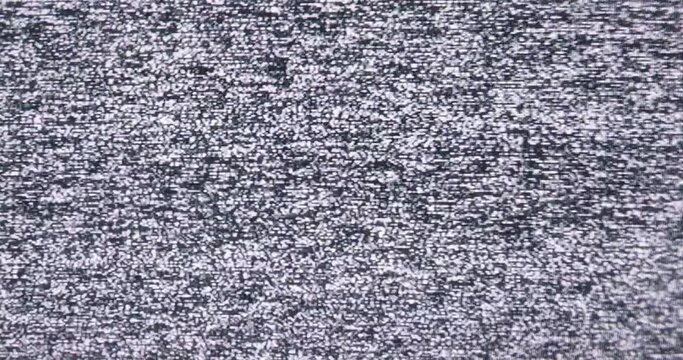 Old Retro TV - Static tv black and white noise caused by bad signal reception