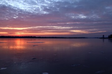 Naklejka premium sunset over the river