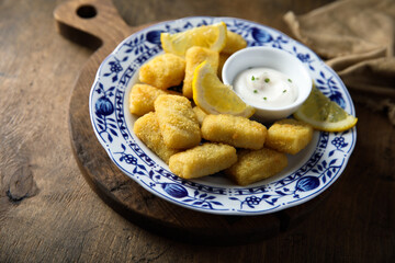 Traditional homemade fish croquettes with sauce