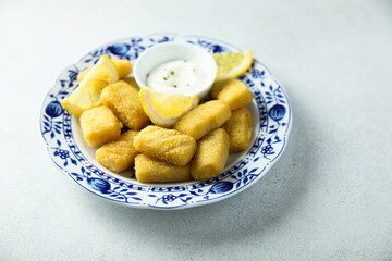 Traditional homemade fish croquettes with sauce